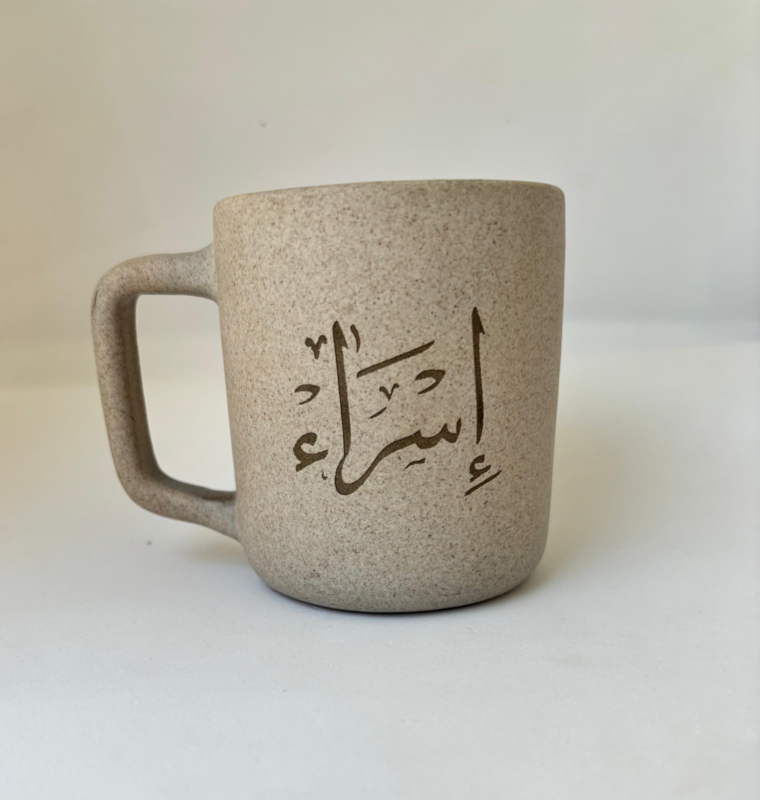 Stoneware mug engraved with a client's name in Arabic